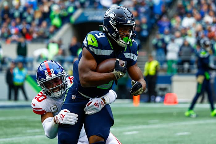 New York Giants safety Julian Love (20) tackles Seattle Seahawks running back Kenneth Walker III (9) on a rushing attempt during the first quarter at Lumen Field.